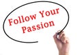 Hand writing Follow Your Passion on transparent board Royalty Free Stock Photo