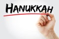 Hand writing Hanukkah with marker, holiday concept background
