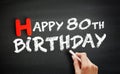 Hand writing Happy 80th birthday on blackboard, holiday concept background Royalty Free Stock Photo