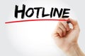 Hand writing Hotline with marker Royalty Free Stock Photo