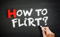 Hand writing How To Flirt? on blackboard, concept background Royalty Free Stock Photo