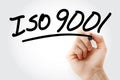 Hand writing ISO 9001 with marker Royalty Free Stock Photo
