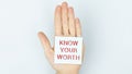 Hand writing Know Your Worth with blue marker on transparent wipe board. Royalty Free Stock Photo