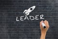 Hand writing leader on wall Royalty Free Stock Photo