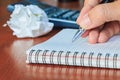 Hand writing notes book on wood table, selective focus. Royalty Free Stock Photo