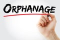 Hand writing Orphanage with marker Royalty Free Stock Photo