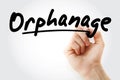 Hand writing Orphanage with marker Royalty Free Stock Photo