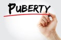 Hand writing Puberty with marker, concept background Royalty Free Stock Photo