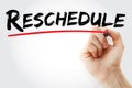 Hand writing Reschedule with marker, business concept background