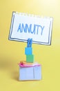Hand writing sign Annuity. Business idea fixed sum of money paid to someone each year Series of payments Colorful Idea