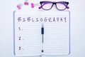 Hand writing sign Bibliography. Word Written on a list of writings relating to a particular subject, period, or author