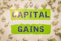 Hand writing sign Capital Gains. Business concept Bonds Shares Stocks Profit Income Tax Investment Funds