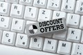 Hand writing sign Discount Offers. Word for amount or percentage deducted from the normal selling price Typing Program