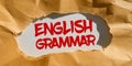 Hand writing sign English Grammar. Business concept courses cover all levels of speaking and writing in english