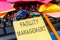 Hand writing sign Facility Management. Concept meaning maintenance of an organization s is buildings and equipment Royalty Free Stock Photo