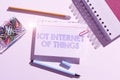 Hand writing sign Iot Internet Of Things. Word Written on Network of Physical Devices send and receive Data Royalty Free Stock Photo