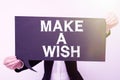 Hand writing sign Make A Wish. Business idea To have dreams desires about future events Be positive Businesswoman