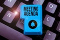 Hand writing sign Meeting Agenda. Internet Concept An agenda sets clear expectations for what needs to a meeting