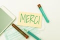 Hand writing sign Merci. Internet Concept what is said or response when someone helps you in France Thank you Sending