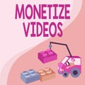 Hand writing sign Monetize Videos. Word Written on process of earning money from your uploaded YouTube videos Man In Royalty Free Stock Photo