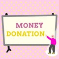 Hand writing sign Money Donation. Business approach a charity aid in a form of cash offered to an association Colorful