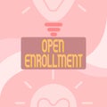 Hand writing sign Open Enrollment. Concept meaning The yearly period when showing can enroll an insurance Glowing Light