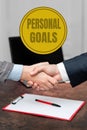 Hand writing sign Personal Goals. Word Written on Target set by a person to influence his efforts Motivation Two Royalty Free Stock Photo