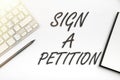 Hand writing sign Sign A Petition. Business overview Support a cause by signing paper with an agreement Businessman in