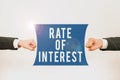 Hand writing sign Rate Of Interest. Business overview Percentage computed from principal amount of loan, mortgage, or