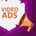 Hand writing sign Video Ads. Business idea Engage audience in the form of video content advertising