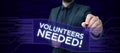 Hand writing sign Volunteers Needed. Business concept Social Community Charity Volunteerism