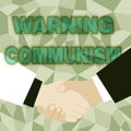 Hand writing sign Warning Communism. Conceptual photo economic system where the group owns the production Abstract