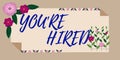 Hand writing sign You Re Hired. Concept meaning New Job Employed Newbie Enlisted Accepted Recruited Frame Decorated With