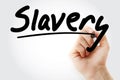 Hand writing Slavery with marker Royalty Free Stock Photo