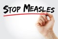 Hand writing Stop Measles with marker, health concept background Royalty Free Stock Photo