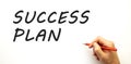 Hand writing SUCCESS PLAN with pen. Isolated on white background. Royalty Free Stock Photo