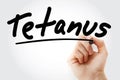 Hand writing Tetanus with marker