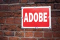 Hand writing text caption inspiration showing ADOBE concept meaning Software Company Name written on old announcement road sign wi