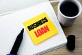 Hand writing text caption inspiration showing Business Loan. Business concept for Lending Finance Credit written on sticky note pa