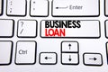 Hand writing text caption inspiration showing Business Loan. Business concept for Lending Finance Credit written on white keyboard