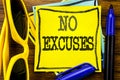 Hand writing text caption inspiration showing No Excuses. Business concept for Stop Ban for Excuse Written on sticky note paper, w Royalty Free Stock Photo