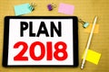 Hand writing text caption inspiration showing Plan 2018. Business concept for Planning Strategy Action Plan Written on tablet lapt