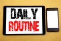 Hand writing text caption inspiration showing Daily Routine. Business concept for Habitual Lifestyle Written on tablet laptop, woo