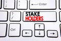 Hand writing text caption inspiration showing Stake Holders. Business concept for Stakeholder Engagement written on white keyboard Royalty Free Stock Photo