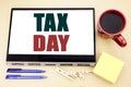 Hand writing text caption inspiration showing Tax Day. Business concept for Income taxation Refund written on tablet laptop. Offic Royalty Free Stock Photo