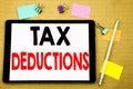 Hand writing text caption inspiration showing Tax Deductions. Business concept for Finance Incoming Tax Money Deduction Written on