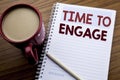 Hand writing text caption inspiration showing Time To Engage. Business concept for Engagement Involvement written on note paper no