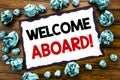 Hand writing text caption inspiration showing Welcome Aboard. Business concept for Greeting Join Member Written on sticky note pap Royalty Free Stock Photo