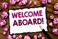 Hand writing text caption inspiration showing Welcome Aboard. Business concept for Greeting Join Member Written on sticky note pap Royalty Free Stock Photo