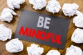 Hand writing text caption showing Be Mindful. Business concept for Mindfulness Healthy Spirit written on sticky note paper on the Royalty Free Stock Photo